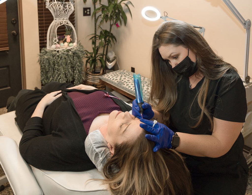 Candi performing microblading treatment at candibrows in clovis, california
